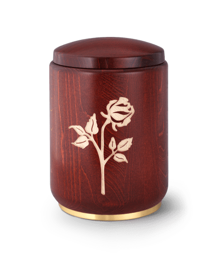 Holzurne in Dunkelbraun mit goldfarbener Rosengravur und passendem Deckel. Untere Kante aus goldenem Metall.